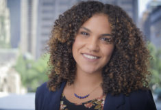 A smiling headshot of Michelle May-Curry.